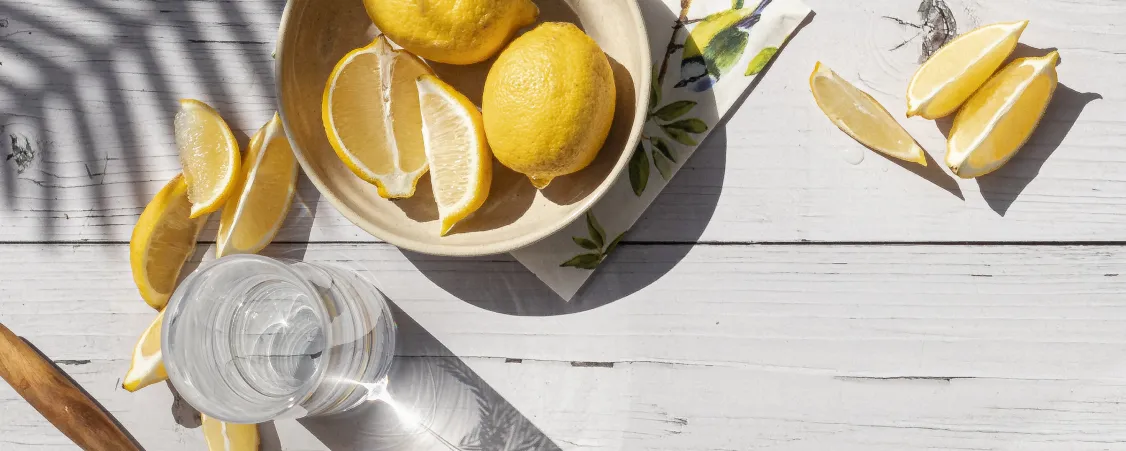 Woman drinking water during intermittent fasting - importance of hydration for fasting success