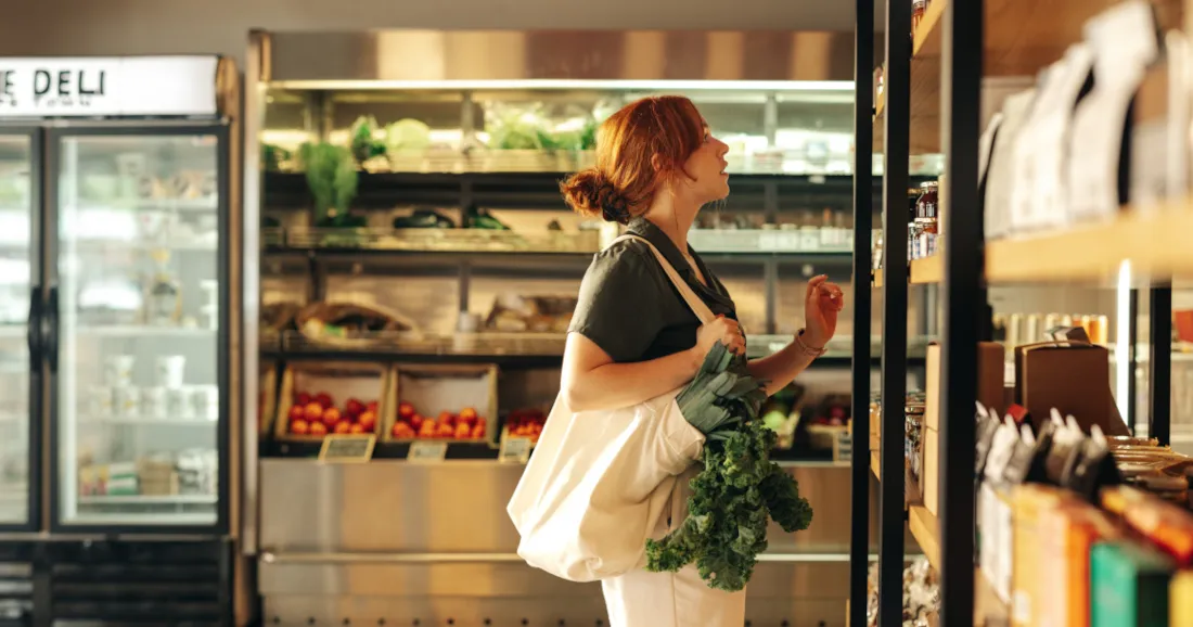 Woman planning 20:4 intermittent fasting schedule with healthy foods and meal timing guide