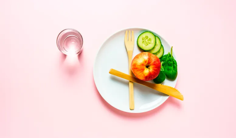 Glass of water representing essential hydration during intermittent fasting for energy and metabolic health