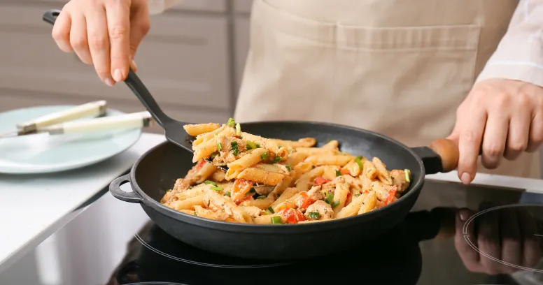 Mediterranean-approved skillet with colorful vegetables, lean protein, and olive oil promoting heart health and weight management