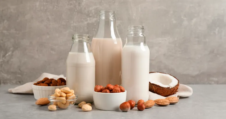Dairy and plant-based milk alternatives including almond soy oat and pea milk with nutrition comparison