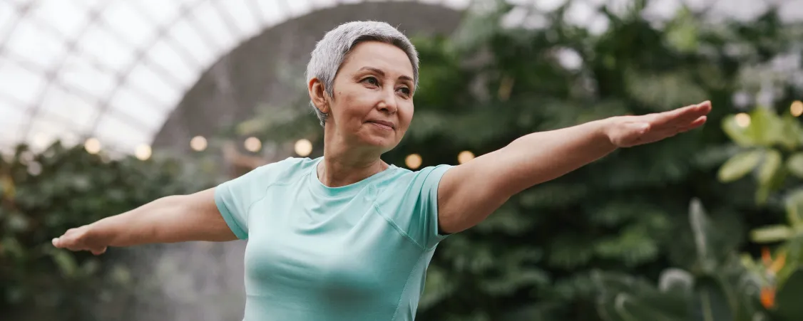 Person doing morning yoga flow showing enjoyable exercise for sustainable fat burning